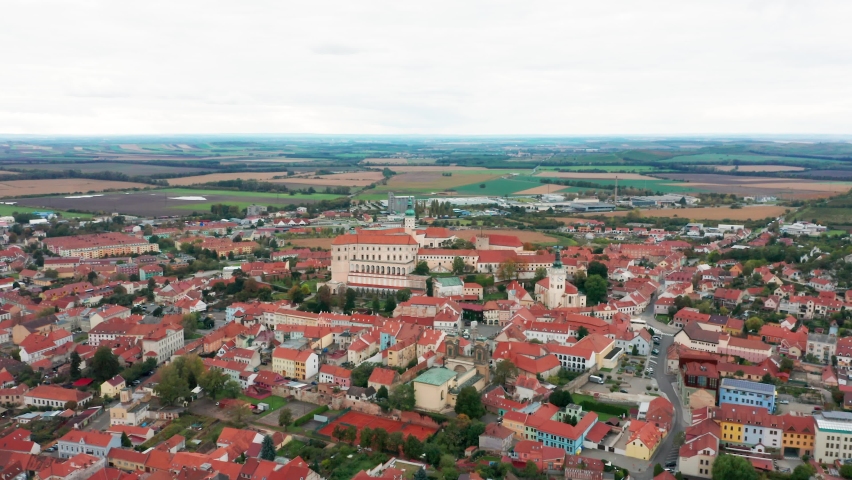 4K drone aerial revealing shot of St Sebastian chapel and bell tower nestled on hills above the town of Mikulov, famous landmark in South Moravia wine region,  Czech Republic