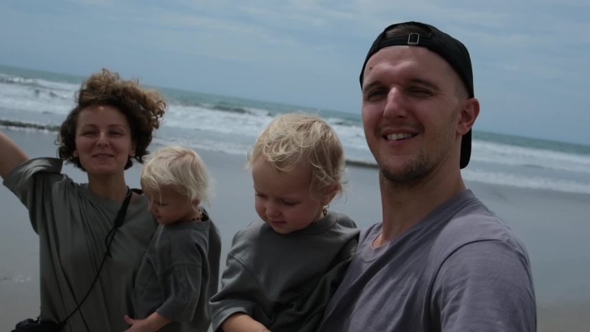 The family in full force, film themselves on video on the ocean. They want to keep pictures of their youth as a keepsake for future generations of their descendants. | Shutterstock HD Video #1095005147