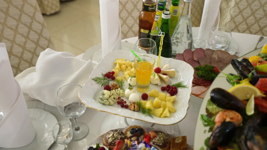 Fresh juice with cheese and berries served on plate on table | Shutterstock HD Video #1095005423