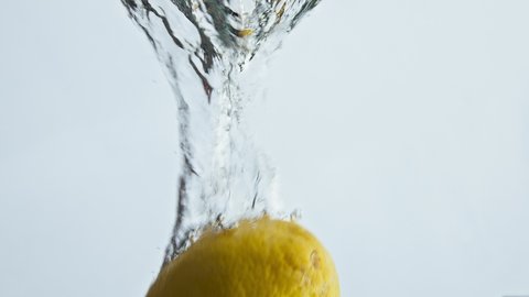 Fresh Lemon Dropping Water Light Background Stock Footage Video (100% ...