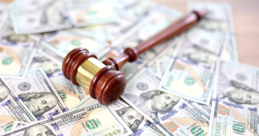Hammer law on money and concept of litigation, bankruptcy or money laundering | Shutterstock HD Video #1095022701