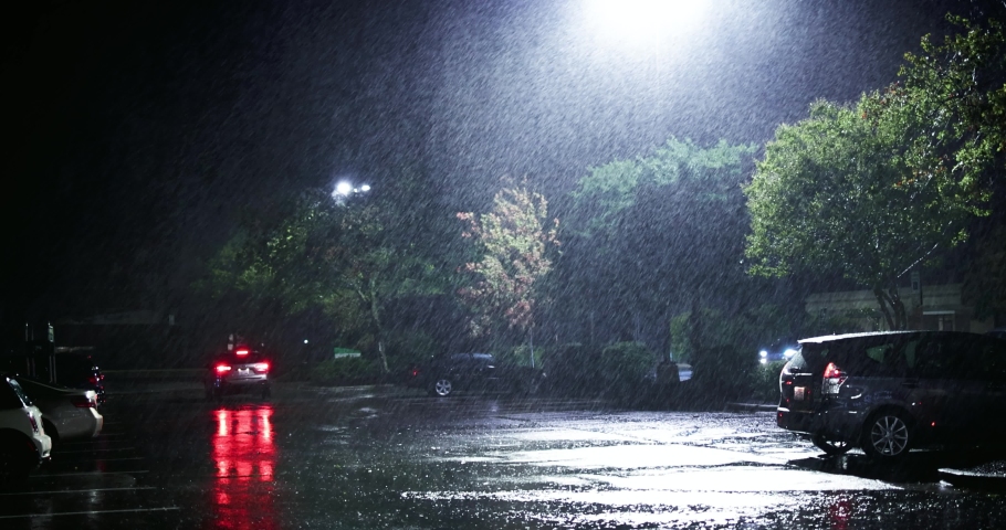 Parking zone, night street under the heavy rain caused by tropical storm Ian on 09.30.2022 in Raleigh, NC, USA