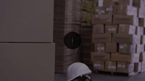 Animation of network of connections with icons over caucasian male worker in warehouse. Global connections, shipping and delivery concept digitally generated video.