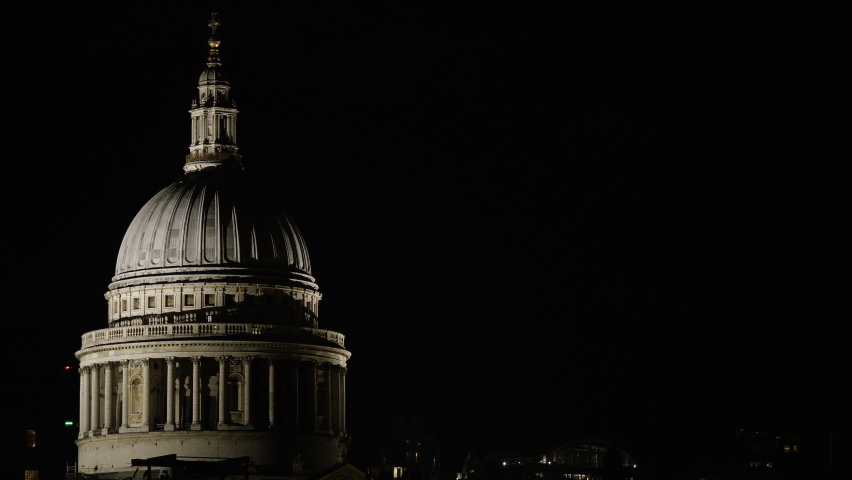 Static shot of St Pauls Cathedral illuminated at night with plenty of copy space in the night sky