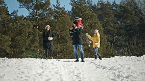 Cheerful family playing snowballs in winter forest - Powered by Shutterstock - Get 15% off with code: PIKWIZARD15