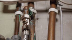 Water and gas pipe plumbing close up stock footage - Powered by Shutterstock - Get 15% off with code: PIKWIZARD15