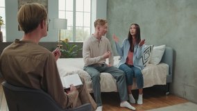 Multiracial couple quarreling at a psychologist appointment. - Powered by Shutterstock - Get 15% off with code: PIKWIZARD15
