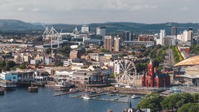 Establishing Aerial View Shot of Cardiff UK, capital of Wales, United Kingdom, day, waterfront, rise up crane shot