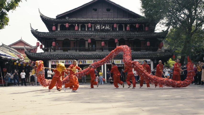 Chengdu, Sichuan, China 1th Oct 2022: Dragon Dance China’s national intangible cultural heritage performance  during China national holiday at Huang long Xi historic Chinese town