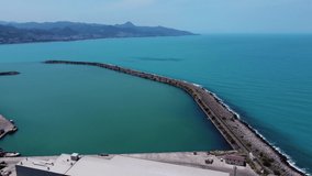 Aerial drone footage of the road and city passing by the coast, Aerial drone footage of the courtyard where the ships stand