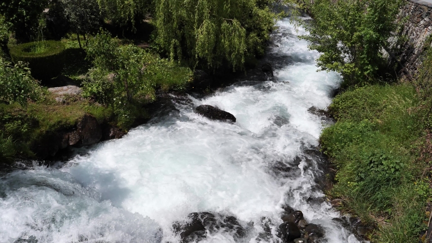 view of a torrent in the countryside in spring, France Pyrenees mountains Royalty-Free Stock Footage #1095059295