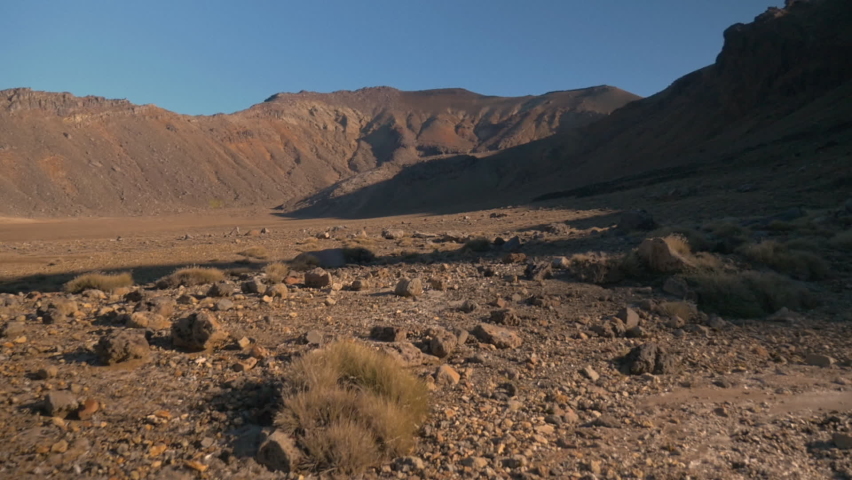 Travelling on a lunar landscape, which looks like the planet Mars