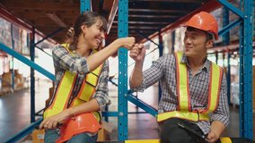 Colleague workers in warehouse factory talking and hands raised up at factory warehouse, Worker team working in the warehouse - Powered by Shutterstock - Get 15% off with code: PIKWIZARD15
