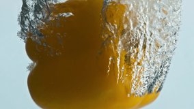 Sweet pepper drop water in light background closeup. Fresh yellow vegetable falling bubbling liquid making swirl. Tasty seasonal salad ingredient. Raw healthy eating. Diet vegan nutrition concept. - Powered by Shutterstock - Get 15% off with code: PIKWIZARD15