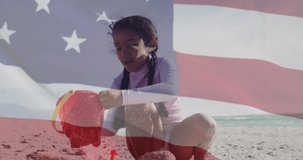 Animation of flag of united states of america over biracial girl playing with sand on beach. American patriotism, diversity and tradition concept digitally generated video.