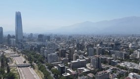 drone video of aerial view of Santiago de Chile city with Mapocho river and Costanera Center in the background with rotation camera movement
