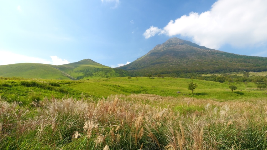 Dramatic view of high mountains and green field under the blue sky, Mt. Yufudake in Oita Prefecture in Japan, Travel or outdoor background, Nobody