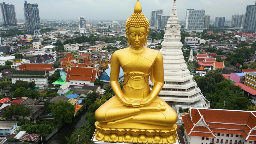 Phra Buddha Dhammakaya Thepmongkhon at Wat Paknam Wat Paknam Bhasicharoen at over 70 metres tall this Buddha is the tallest in Bangkok, Thailand. Drone 4k. Royalty-Free Stock Footage #1095088127