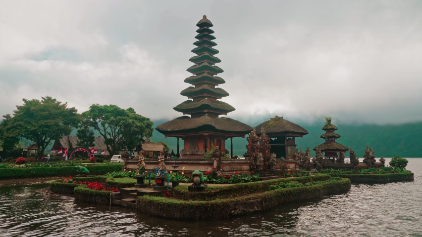 Pura Ulun Danu temple on the lake Bratan in Bali, Indonesia is a major water temple on Bali. Bali Attractions and landmarks in 4k Royalty-Free Stock Footage #1095093373
