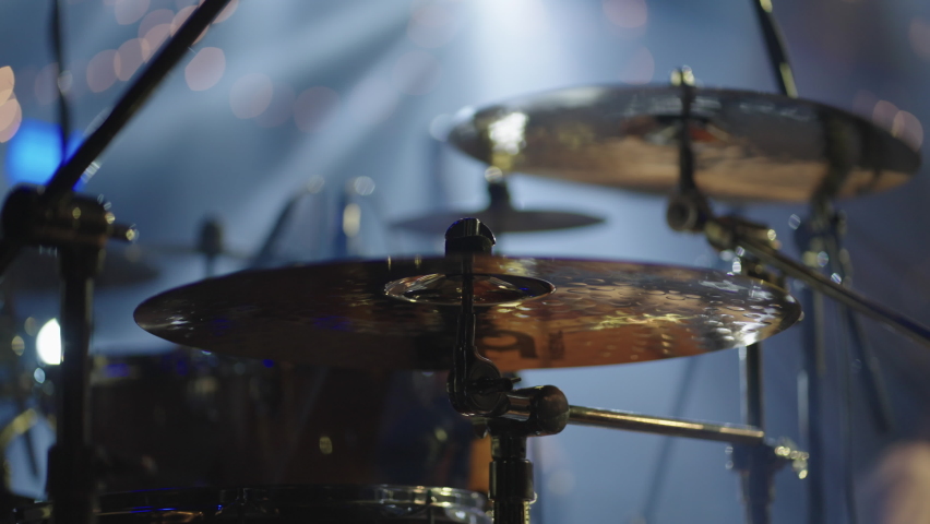 cool guy is playing drum set, striking drums and cymbals by drum sticks, closeup view from stage Royalty-Free Stock Footage #1095094781