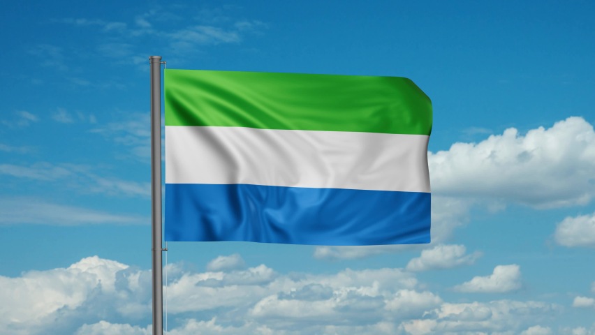 Sierra Leone or Salone flag  waving in the wind cycle looped video, with blue sky 