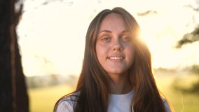 teen girl portrait in the park. close-up a girl child in nature. happy family teenager concept. happy girl smiling. cheerful teen girl portrait close-up. teenager sun outdoors nature in the park - Powered by Shutterstock - Get 15% off with code: PIKWIZARD15