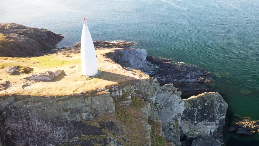 360 degree aerial view around The Baltimore Beacon in South West Cork. Sun is shining.