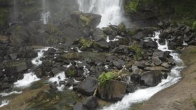 Drone Move in close with tilt shot Nauyaca waterfall Costa Rica