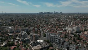 Gennevilliers suburb with financial district skyscrapers and tour Eiffel in background, France. Aerial forward
