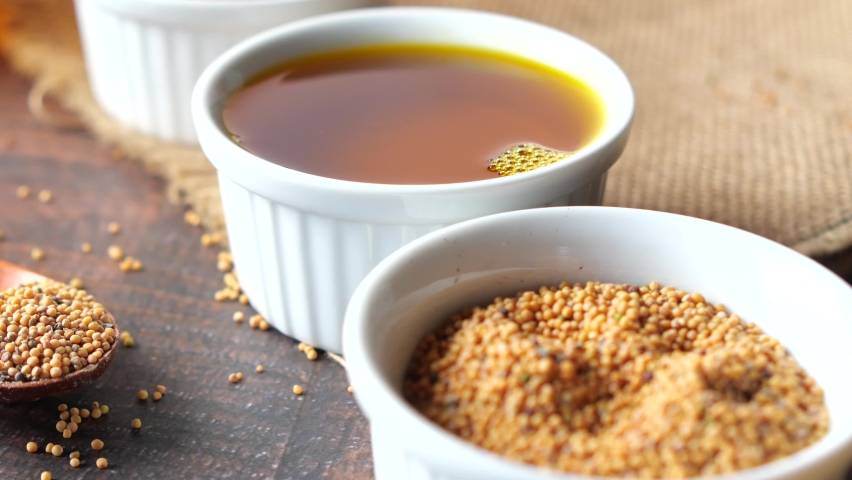 Mustard oil in a plastic jar on table 