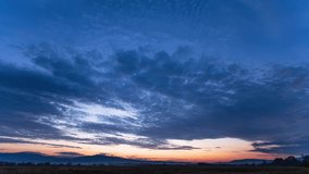 Time lapse of majestic sunset or sunrise landscape with clouds and mountains. Сolorful sky with moving clouds