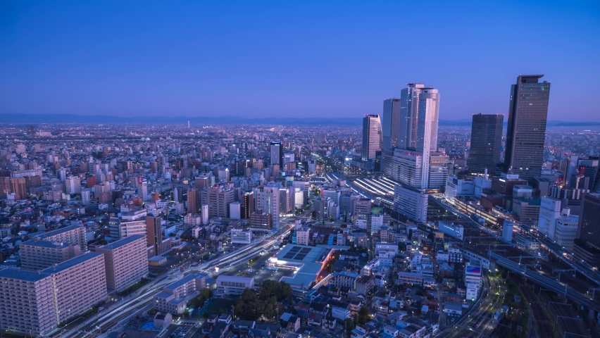 Nagoya Aichi Japan time lapse 4K, city skyline night to day timelapse at Nagoya railway station and business center