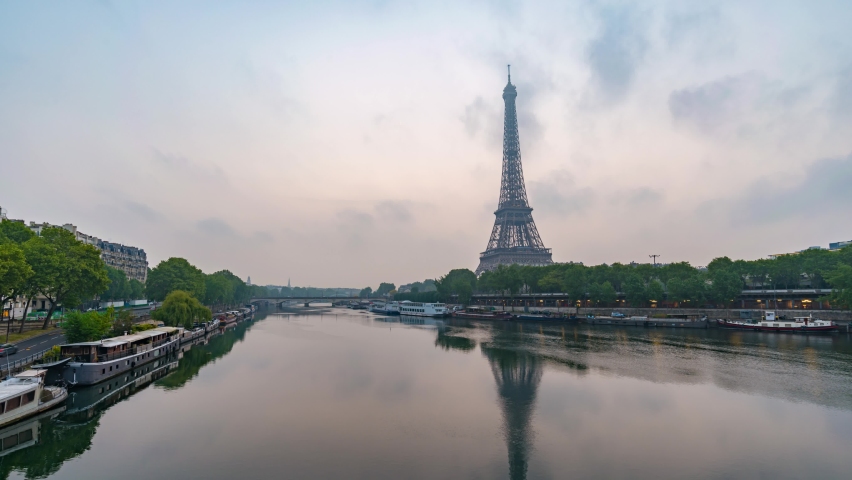 Paris France time lapse 4K, city skyline sunrise timelapse at Eiffel Tower and Seine River