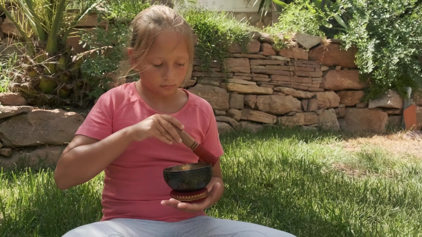 a girl with Tibetan bowl