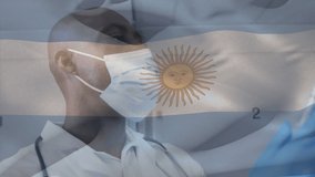 Animation of flag of argentina waving over doctor wearing face mask and holding vaccine. global medicine, healthcare services during covid 19 pandemic concept digitally generated video.
