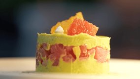 4K video with the preparing of a fine dish gourmet food, tuna tartare with avocado. Close up view of the ingredients and chef hand detail.