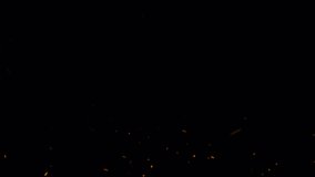 Abstract seamless loop fire ash sparks rising up with transparent alpha channel can be used for overlay your project. 4K 3D chaotic motion of fiery orange glowing flying ember burning ash particles. - Powered by Shutterstock - Get 15% off with code: PIKWIZARD15