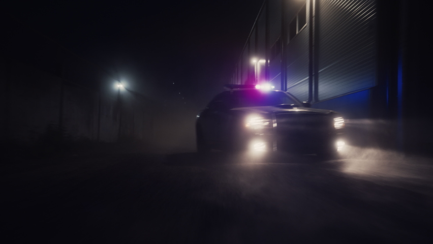 Traffic Patrol Car in Pursuit. Police Officers in Squad Car Chasing Suspect on Industrial Road, Sirens Blazing, High Speed. Cops on Emergency Response Call. Stylish Cinematic High Speed Action Scene | Shutterstock HD Video #1095134989