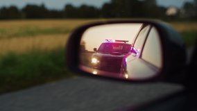 Stylish Side Mirror Car Chase Shot: Highway Traffic Patrol Vehicle Pull over Suspect. Professional Female Police Officer Approaches Vehicle, Asks Driver License and Registration. Cinematic Shot - Powered by Shutterstock - Get 15% off with code: PIKWIZARD15