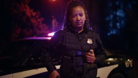 Professional Blaсk Female Police Officer Looking at the Camera. Policewoman Maintains public order and safety, Enforcing the Law, Prevents and Investigates Criminal Activity. Cinematic Portrait - Powered by Shutterstock - Get 15% off with code: PIKWIZARD15