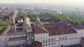 Inscription on video. Turin, Italy. Royal Palace in Turin. Flight over the city. Historical center, top view. Flames with dark fire, Aerial View