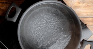 Flat lay video of boiling water in the pot