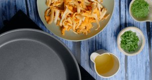 Flat lay video of cooking: chanterelle mushrooms is fried on the hot pan