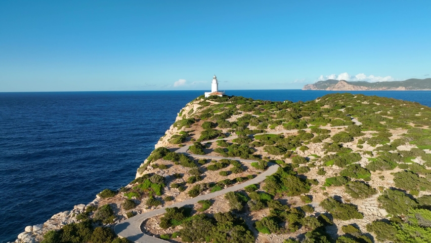 Lighthouse in Ibiza at the Top of a Tall Cliff Aerial View