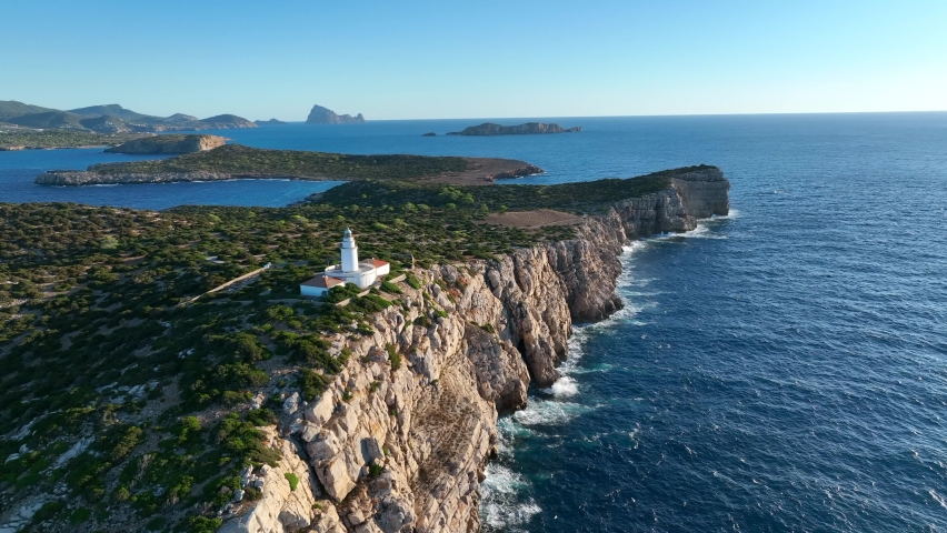Lighthouse in Ibiza at the Top of a Tall Cliff Aerial View