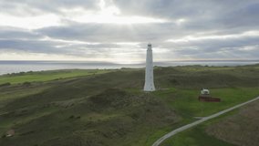 Drone aerial footage of Cape Wickham Lighthouse early in the morning on a cloudy day on the northern part of King Island in Tasmania