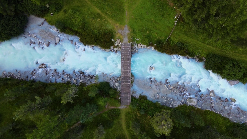 Switzerland blue river wooden bridge