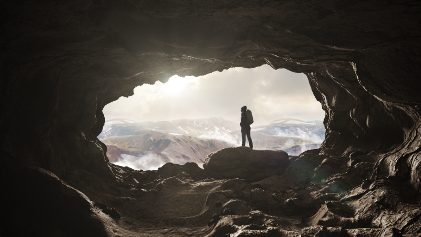 Success achievement,hiker standing on top of a mountain cave enjoy the view,climber female enjoying freedom,nature exploration spirit