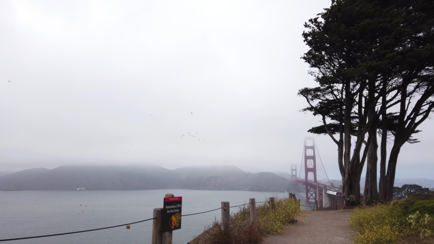DOLLY SHOT - View of the Golden Gate Bridge from the Battery Bluff Trail View Point in San Francisco, California, USA.
