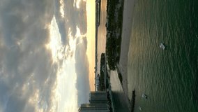 Vertical aerial Miami inlet sunset 4k
